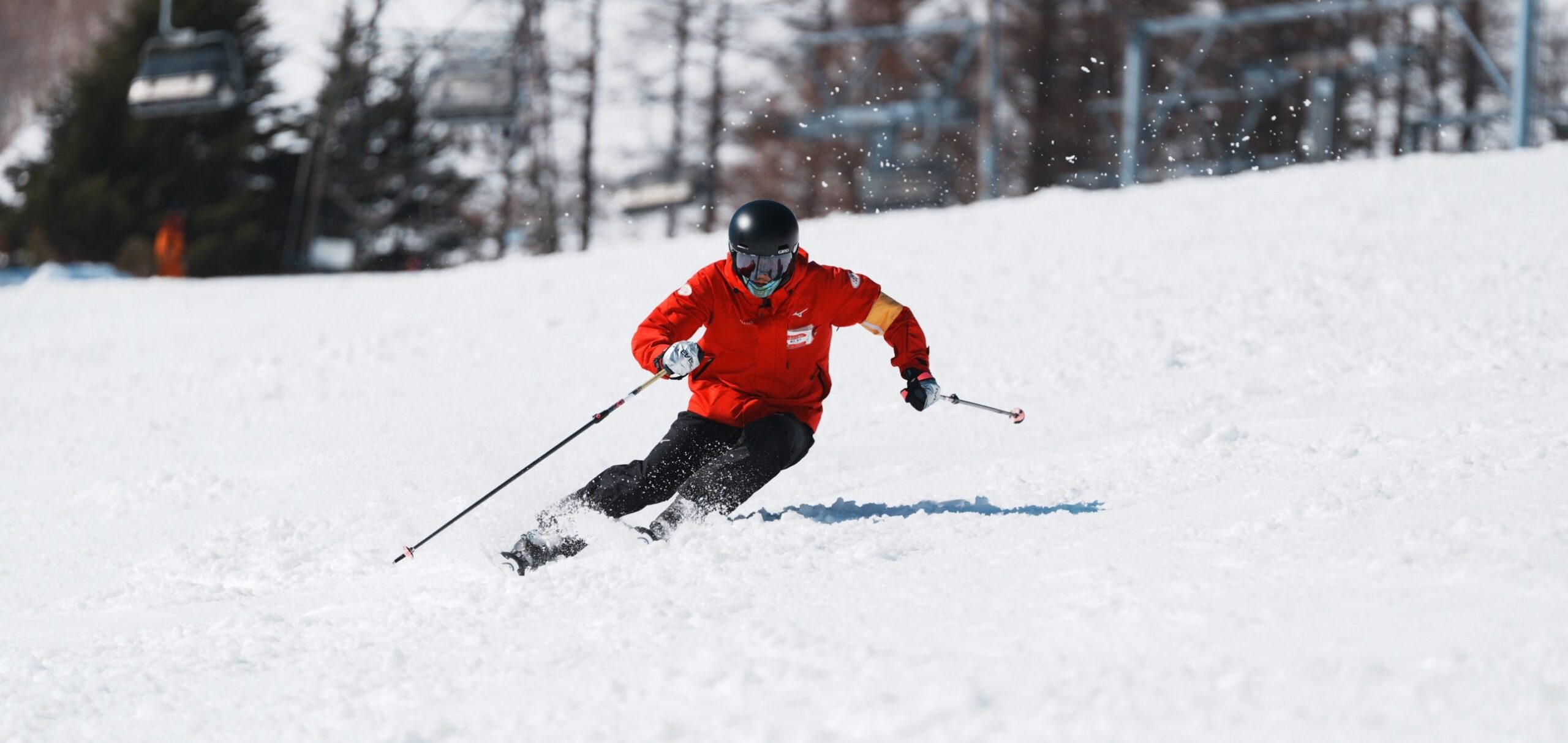 Naeba Ski School coach carving on a sunny slope
